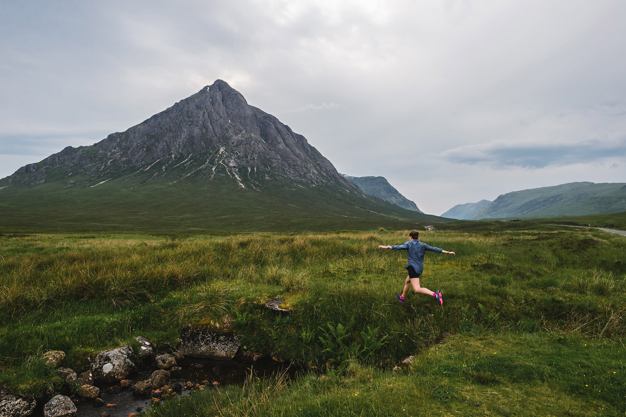 woman in front of scottish mountain