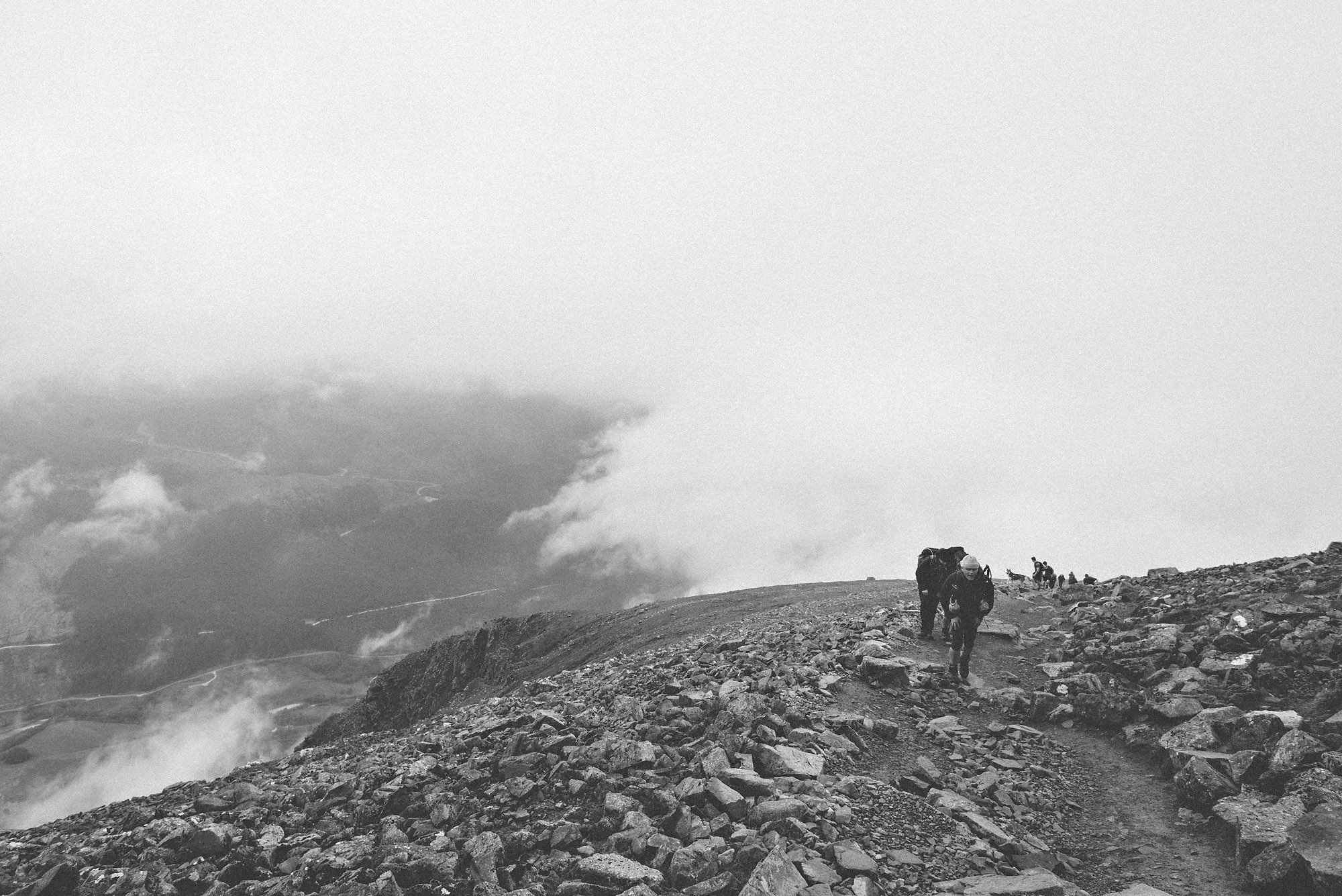 Climbers hiking atop Ben Nevis in Scotland