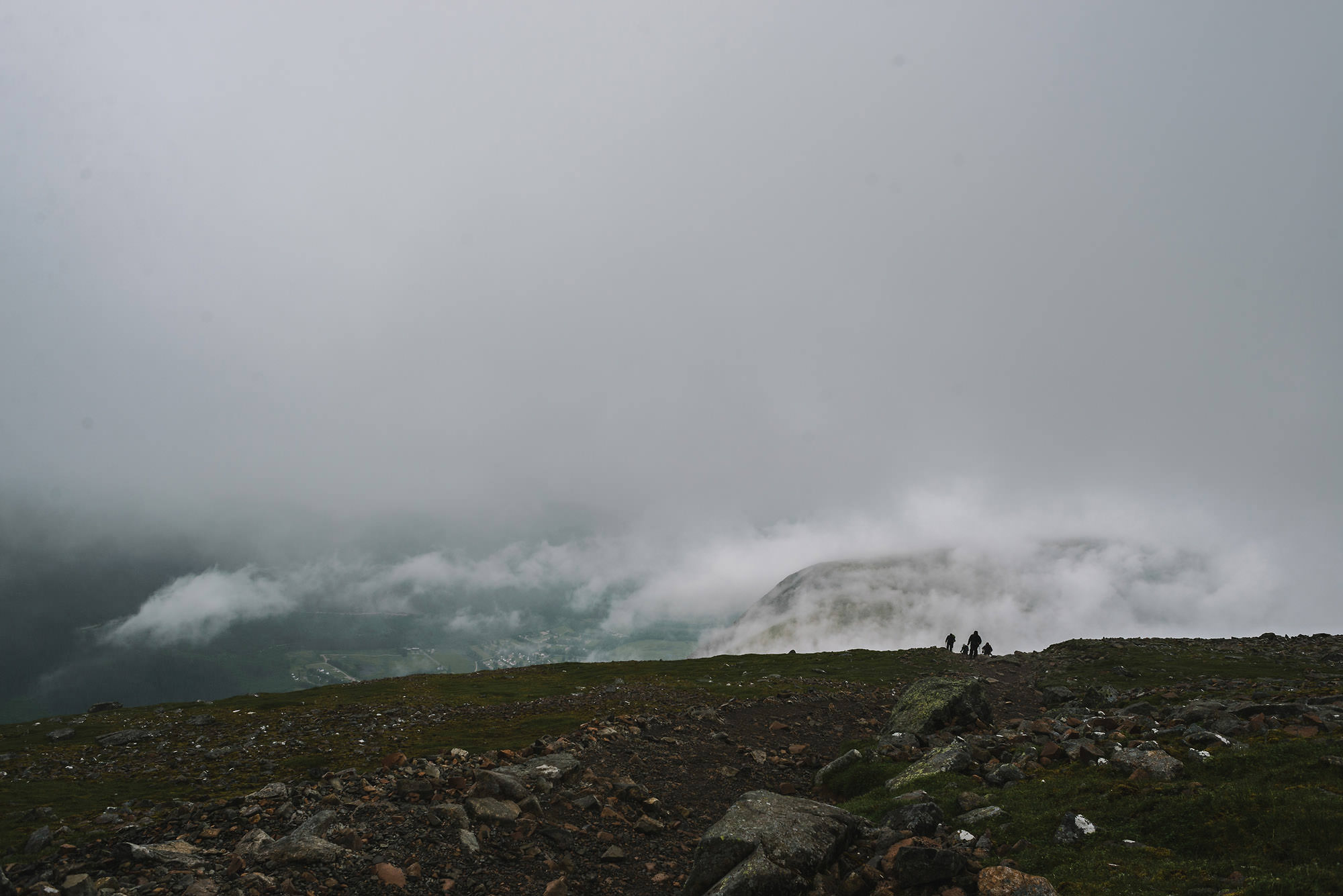 Climbers hiking atop Ben Nevis in Scotland