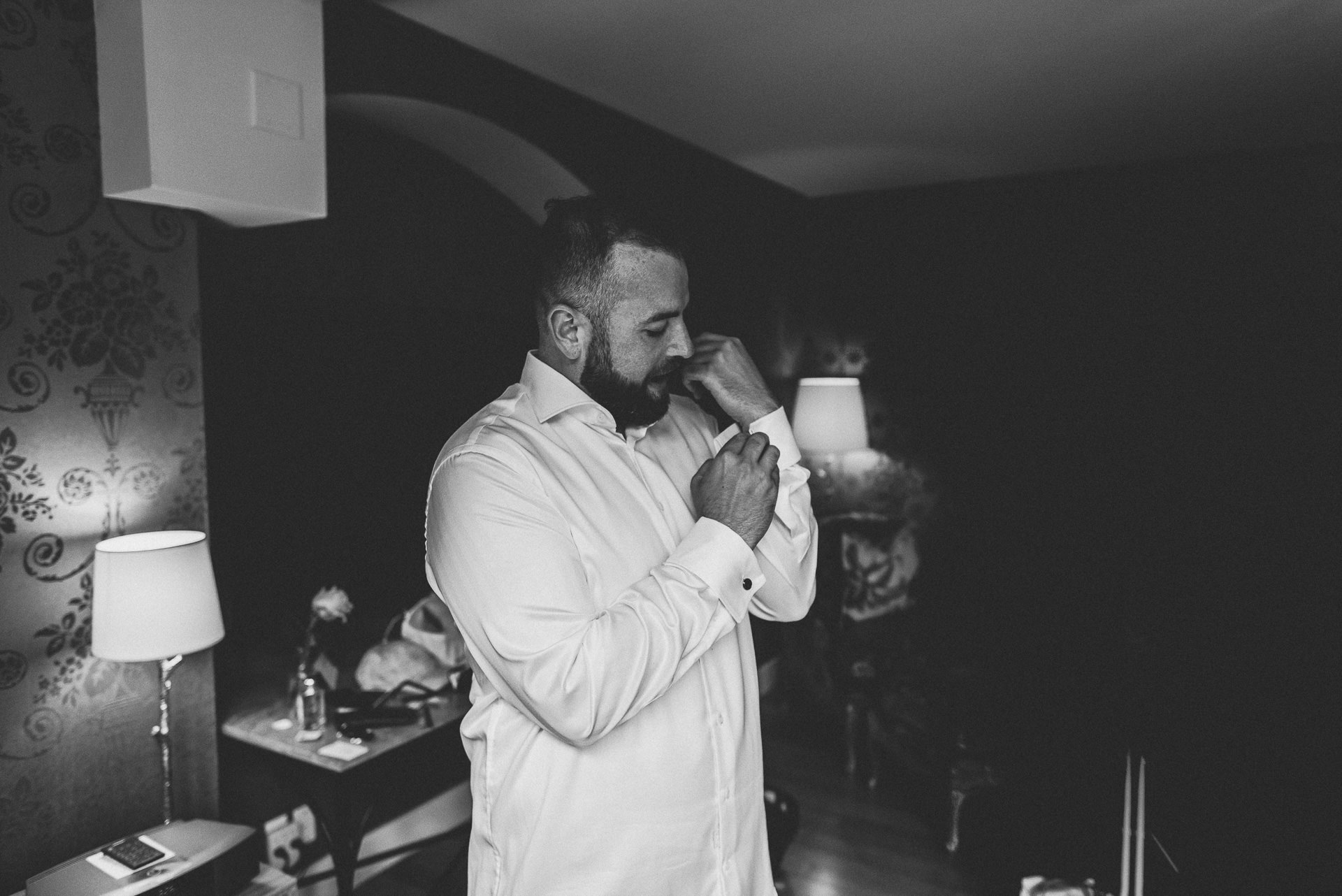 groom getting ready at the ivy
