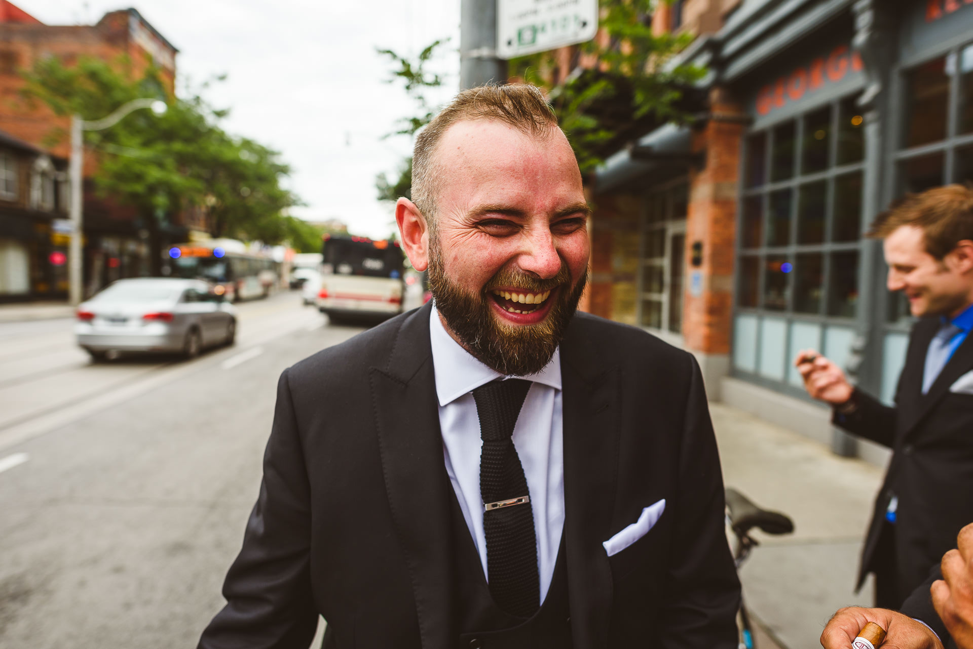 Candid laughing moment of groom